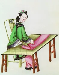 Eine chinesische Frau schneidet Stoff, Qianlong-Periode (1736-96)